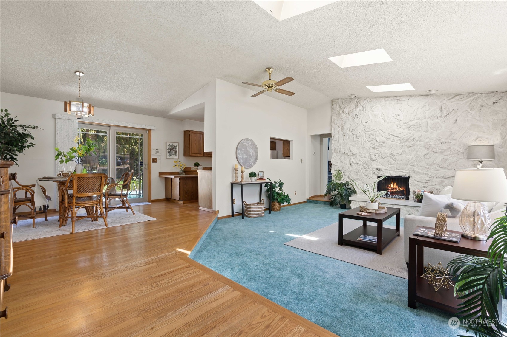 11801 Silver Way Everett, WA 98208 - Photo 5 of 32 a living room with fireplace furniture and a wooden floor