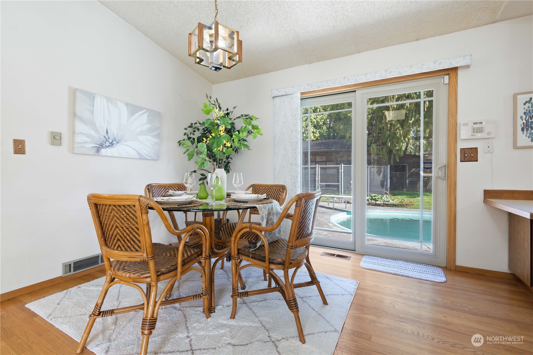 11801 Silver Way Everett, WA 98208 - Photo 6 of 32 a dining room with furniture potted plants and wooden floor