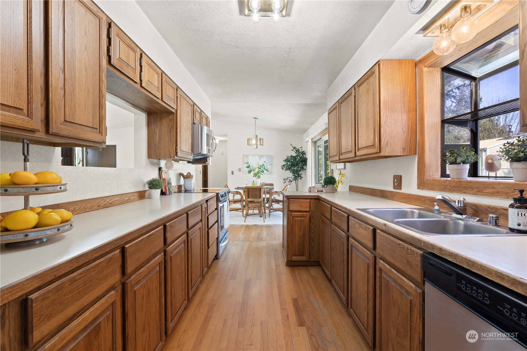 11801 Silver Way Everett, WA 98208 - Photo 7 of 32 a kitchen with a sink stove and cabinets