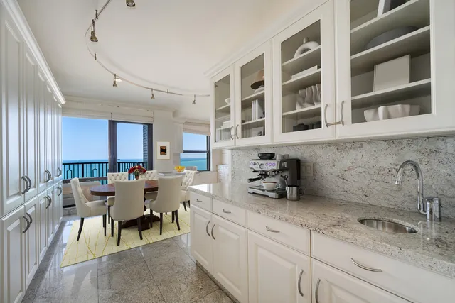 a kitchen with a sink and cabinets