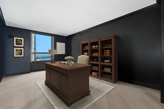 a living room with a furniture and a bookshelf