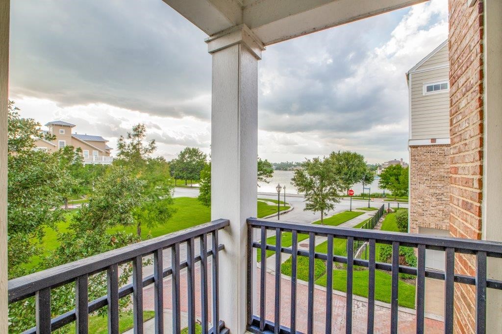 46 East Rafters Row The Woodlands, TX 77380 - Photo 3 of 25 Enjoy peaceful views of Lake Woodlands from your private second-floor balcony.