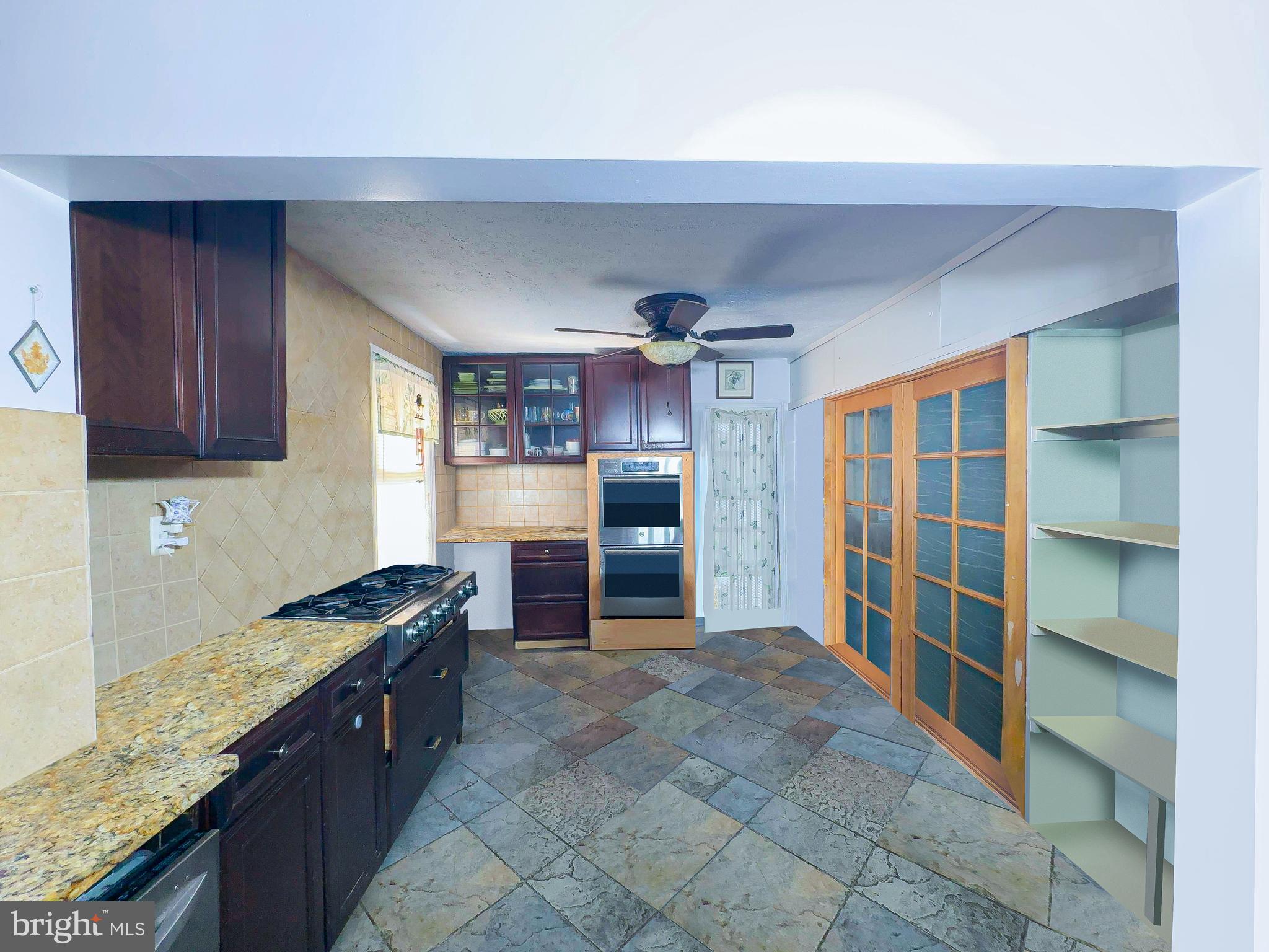 408 44th Street Northeast Washington, DC 20019 - Photo 3 of 13 a kitchen with stainless steel appliances granite countertop a refrigerator and a sink