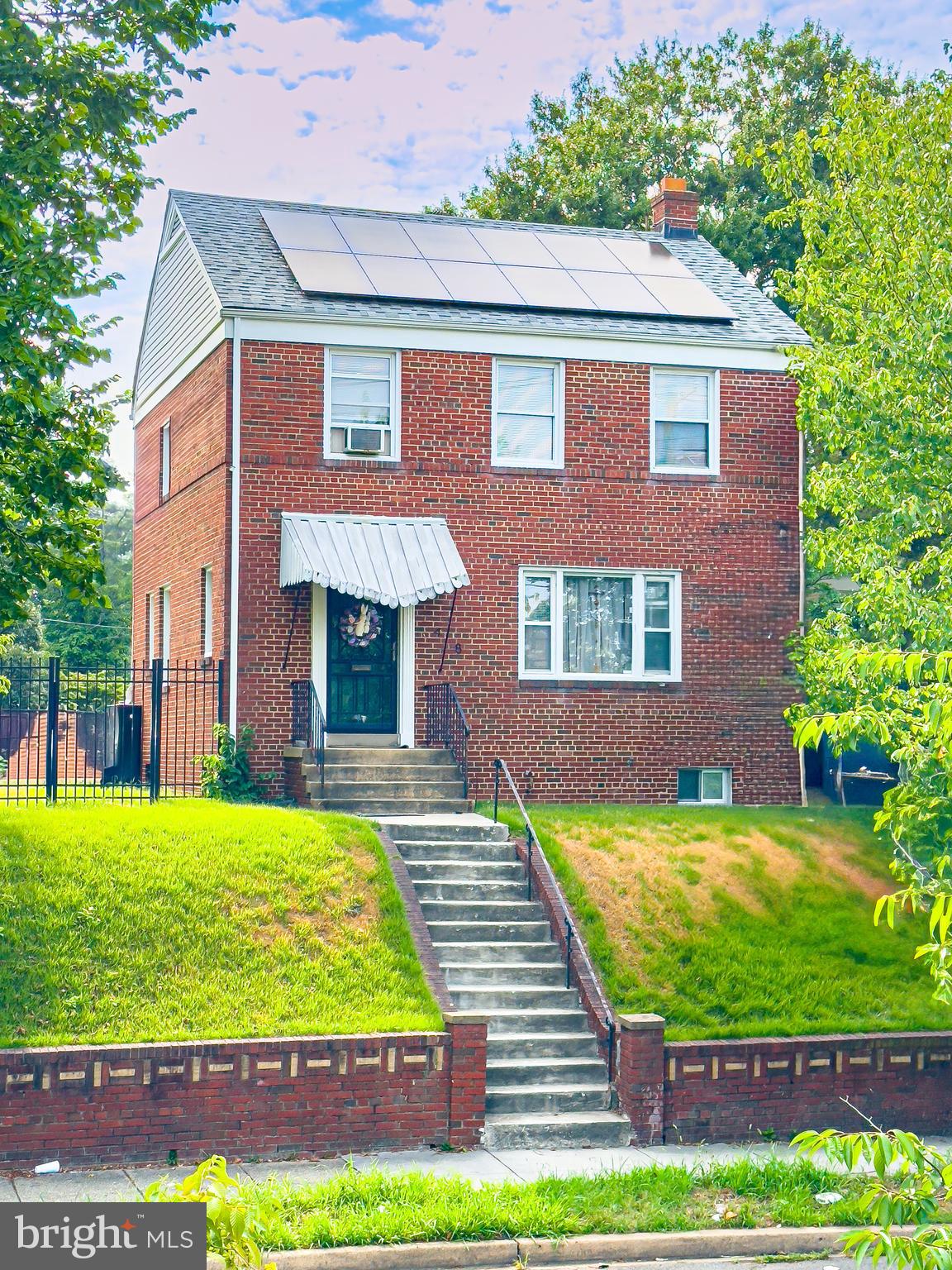 408 44th Street Northeast Washington, DC 20019 - Photo 8 of 13 a view of a house with a yard
