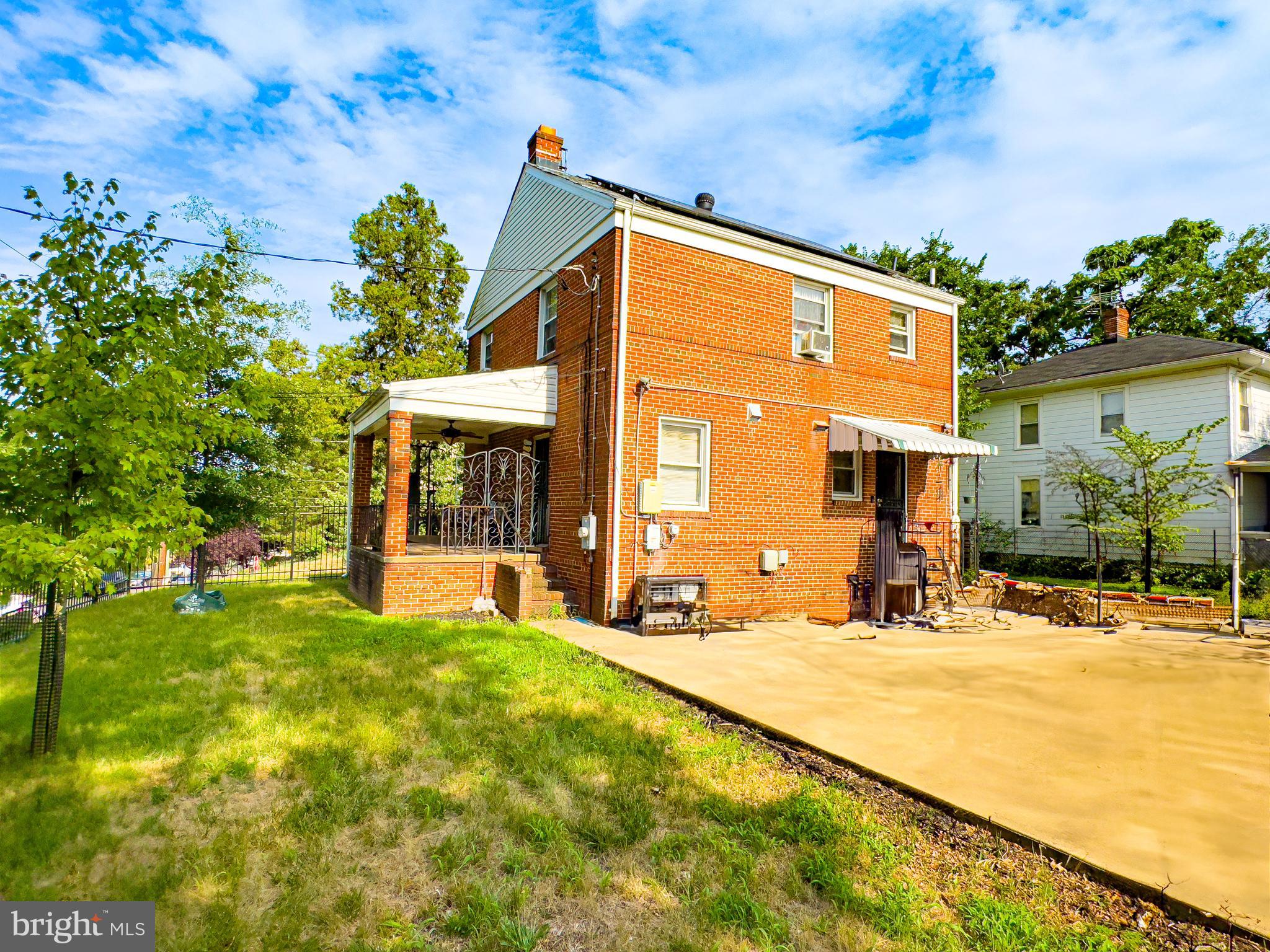 408 44th Street Northeast Washington, DC 20019 - Photo 10 of 13 a front view of a house with a yard