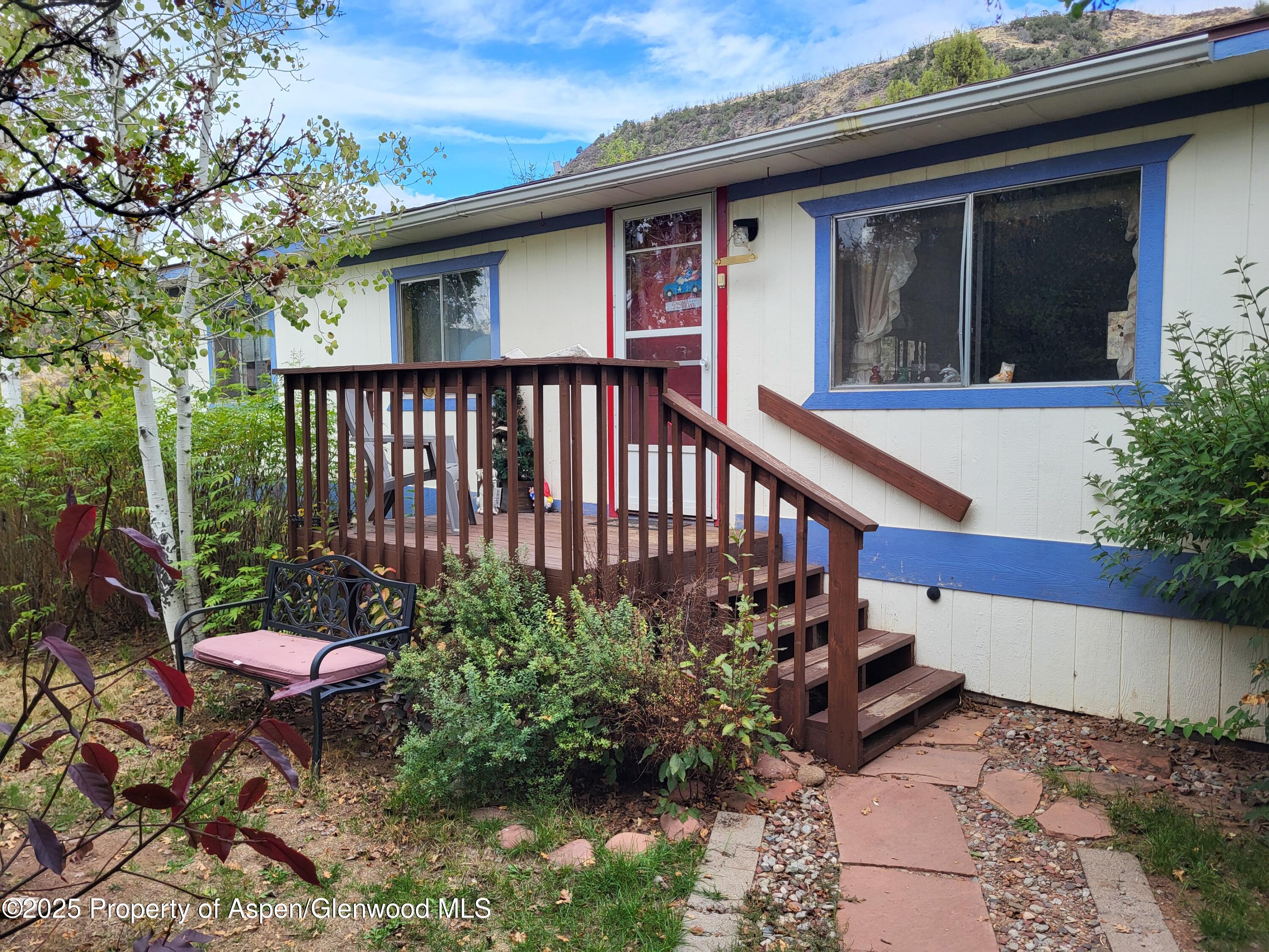 a view of a chair and table in the balcony