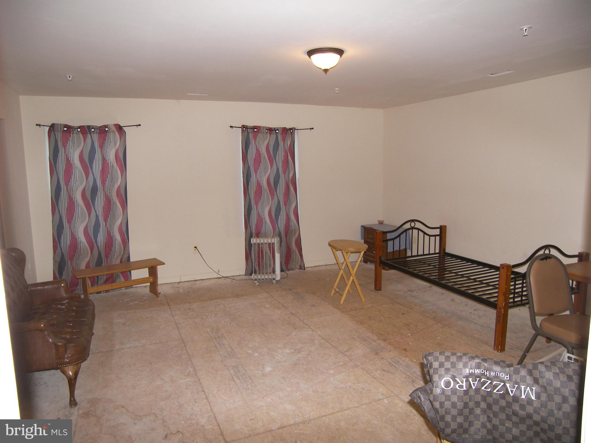 9507 Good Luck Road Lanham, MD 20706 - Photo 8 of 18 a view of a livingroom with furniture and a couch