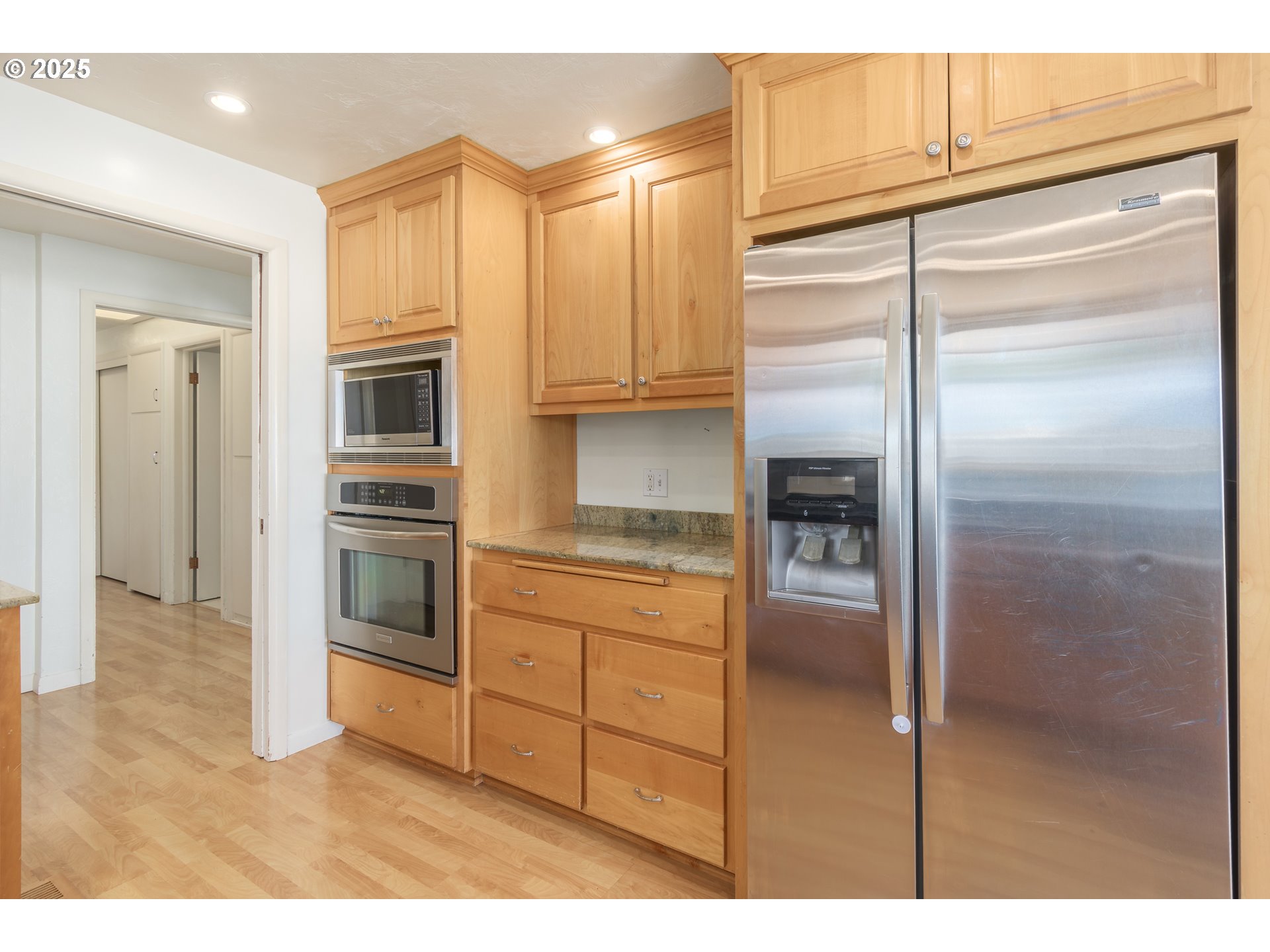 708 Blackstone Street Springfield, OR 97477 - Photo 12 of 45 a kitchen with cabinets and stainless steel appliances