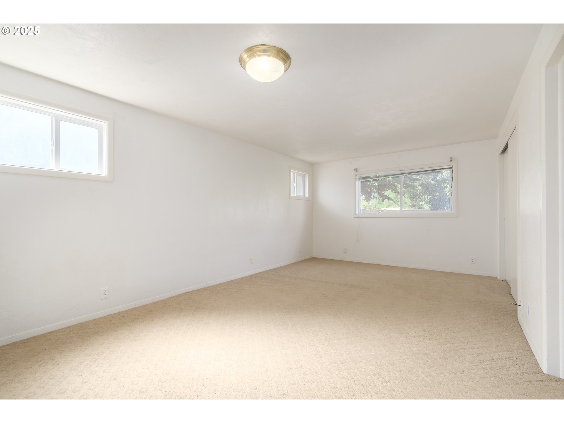 708 Blackstone Street Springfield, OR 97477 - Photo 15 of 45 a view of an empty room with a window