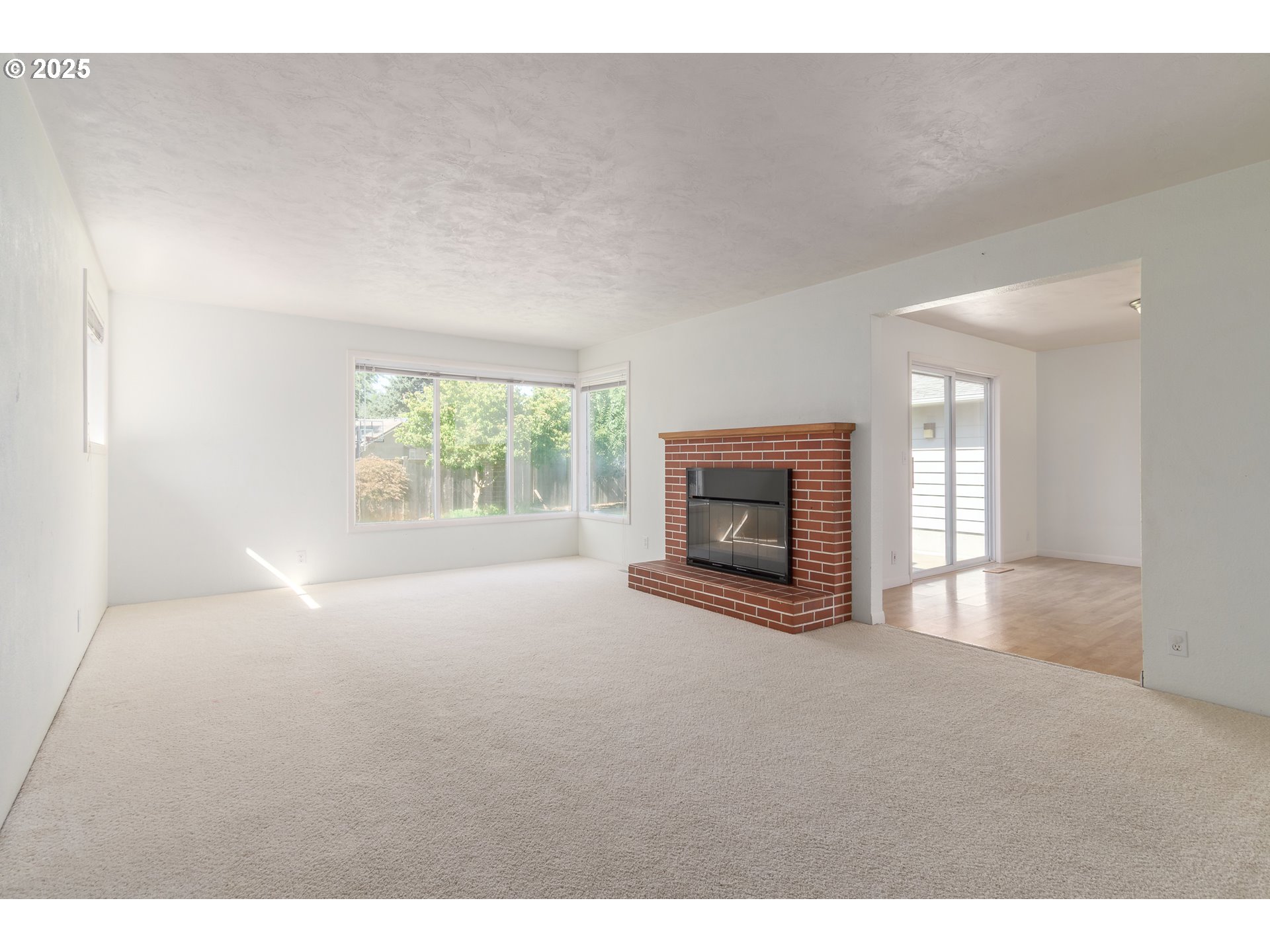 708 Blackstone Street Springfield, OR 97477 - Photo 3 of 45 a view of empty room with a fireplace