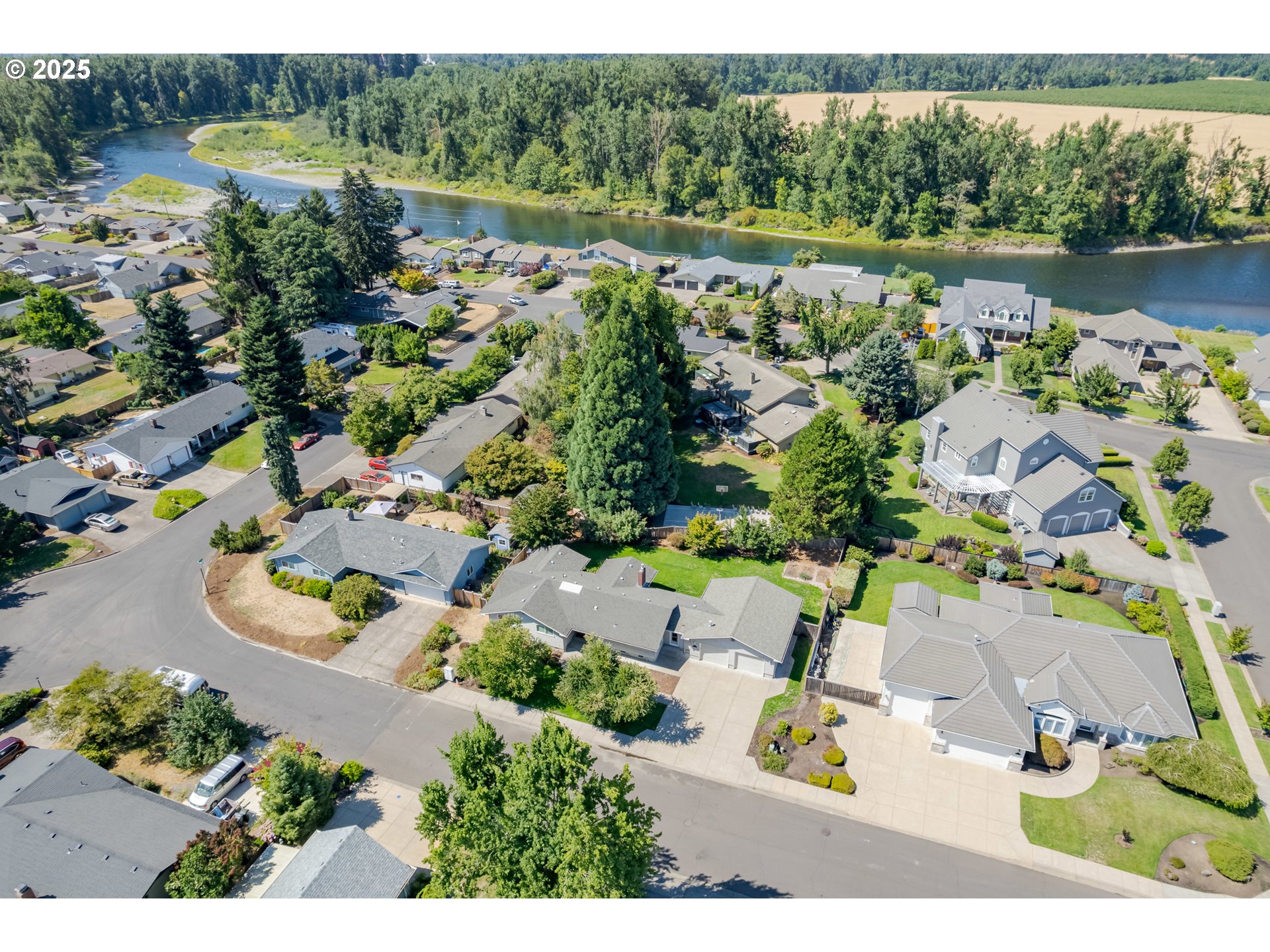 708 Blackstone Street Springfield, OR 97477 - Photo 44 of 45 an aerial view of a house with a yard and lake view