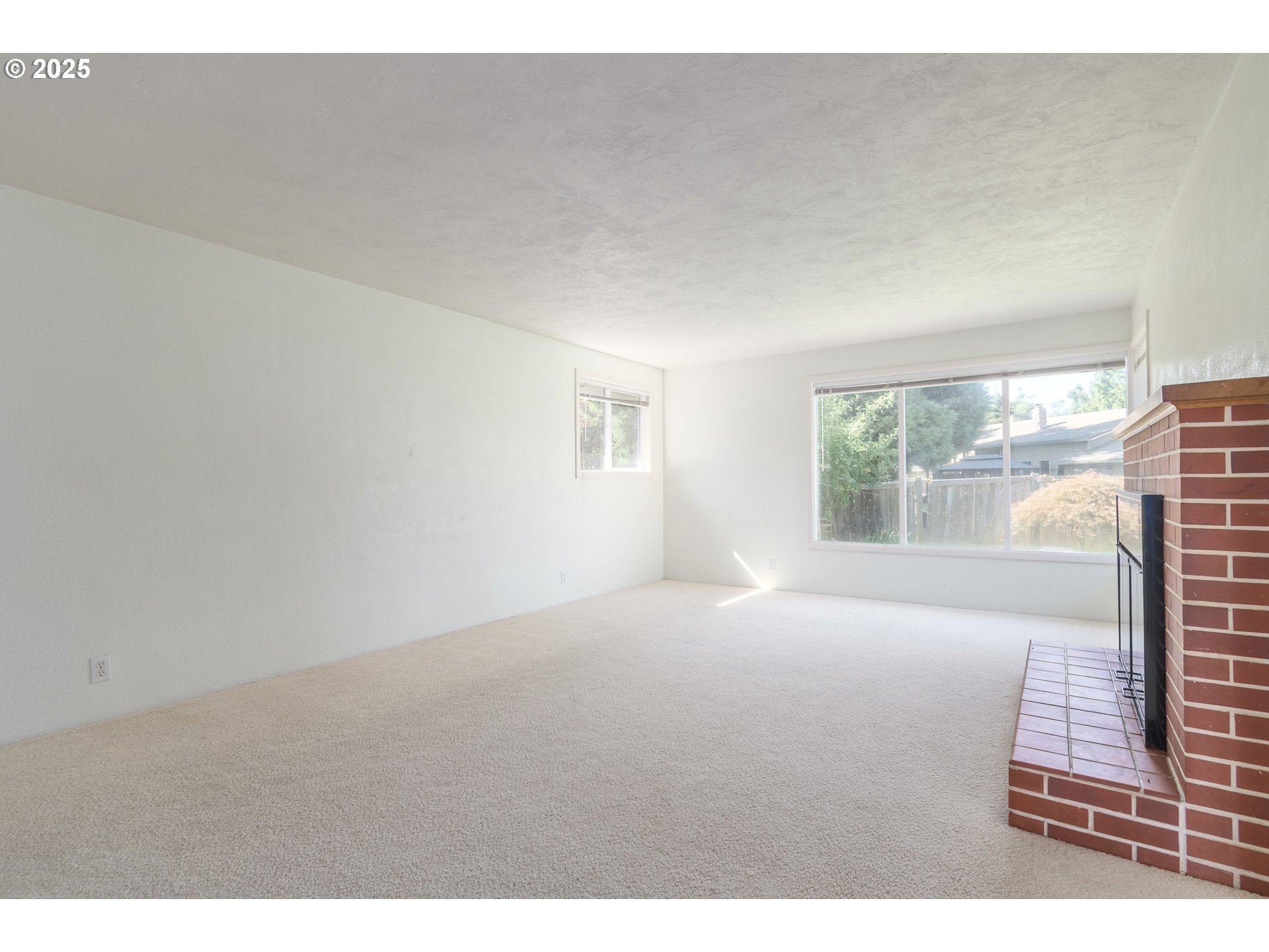 708 Blackstone Street Springfield, OR 97477 - Photo 5 of 45 a view of an empty room with a window
