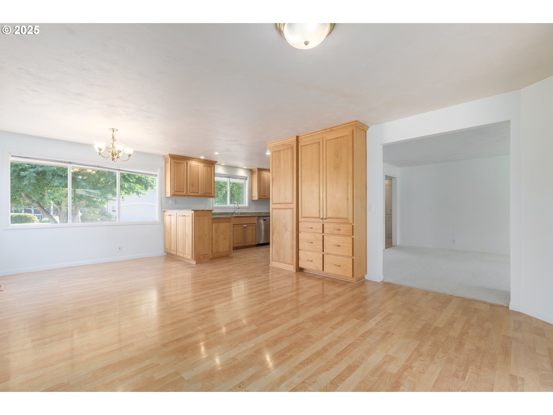 708 Blackstone Street Springfield, OR 97477 - Photo 6 of 45 a view of a kitchen cabinets and wooden floor