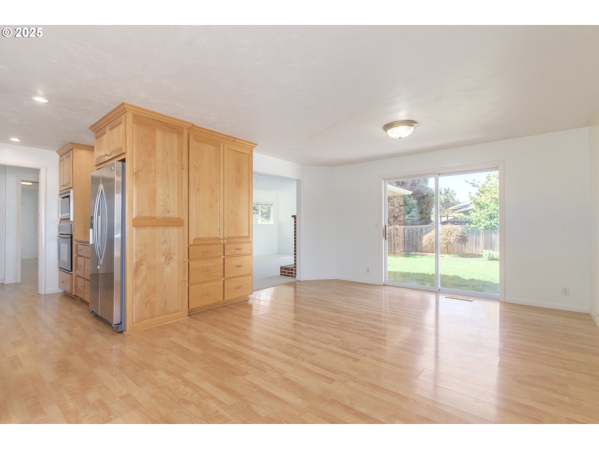 708 Blackstone Street Springfield, OR 97477 - Photo 7 of 45 a view of an empty room and wooden floor
