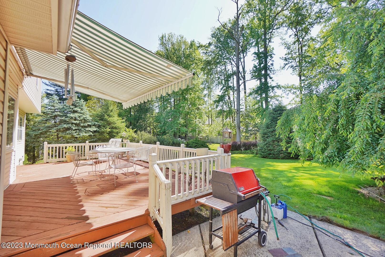 11 Grant Road Manalapan, NJ 07726 - Photo 9 of 26 PATIO&DECK FOR HOSTING OR LOUNGING