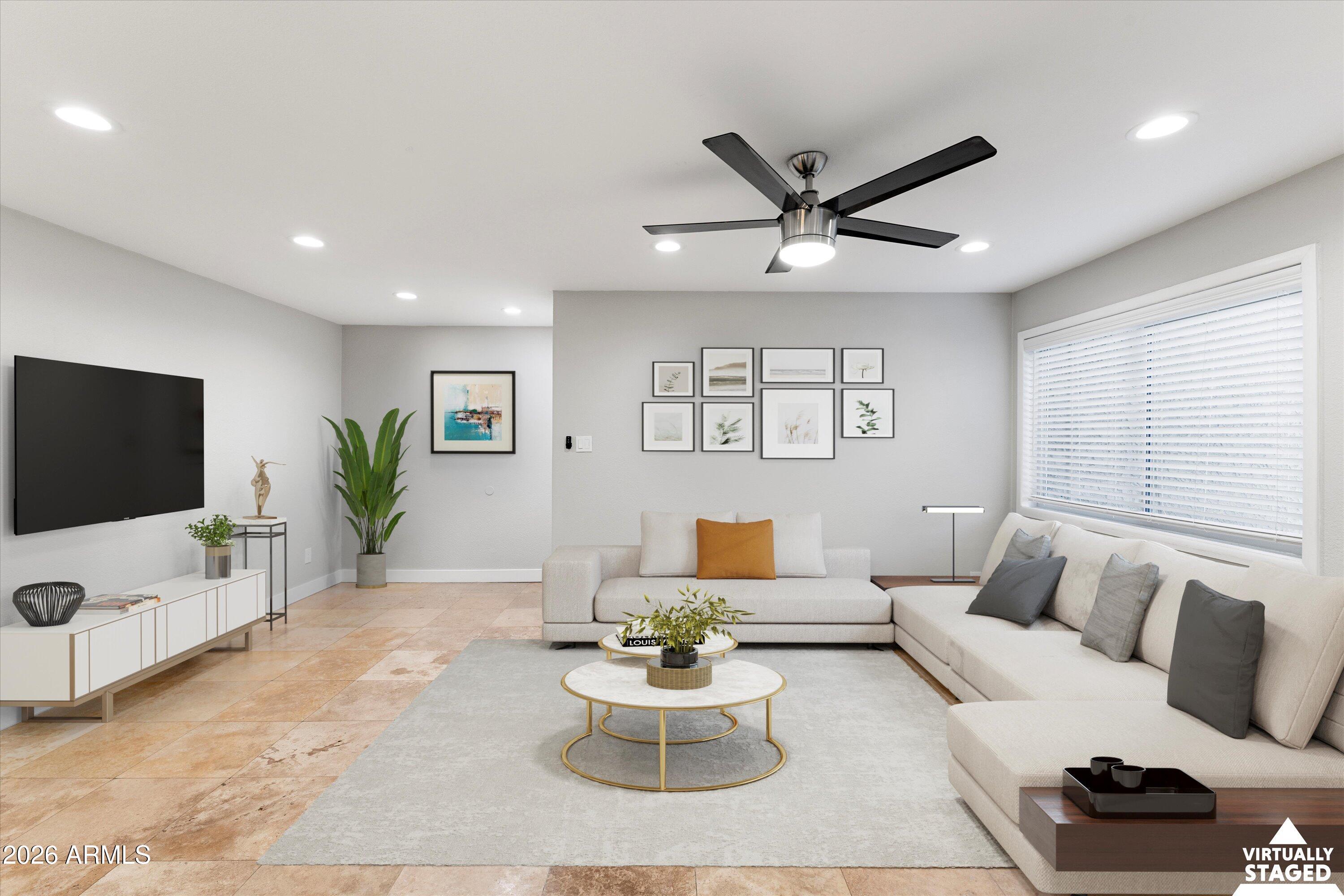 5525 East Thomas Road, Unit L1 Phoenix, AZ 85018 - Photo 17 of 33 a living room with furniture and a flat screen tv