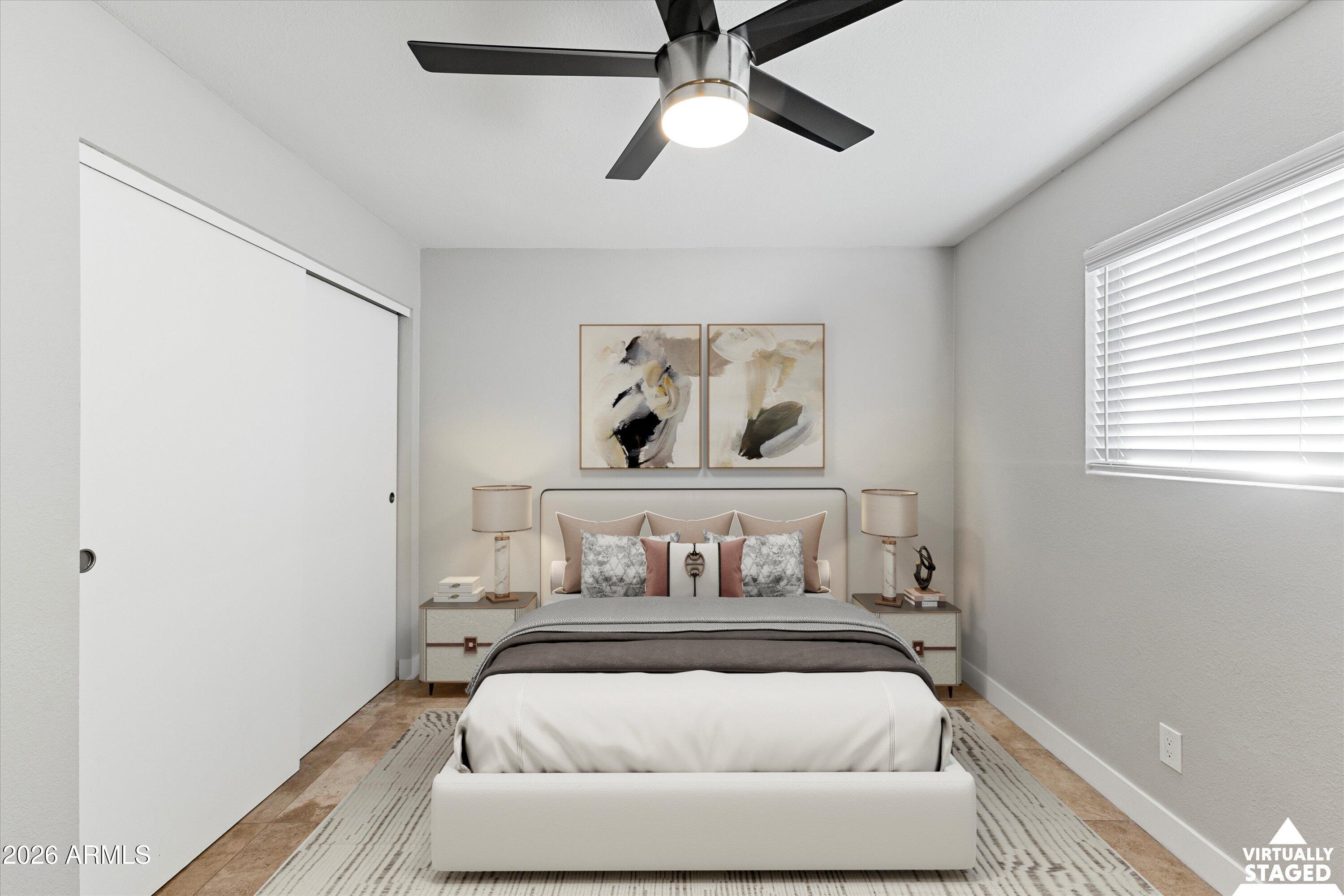 5525 East Thomas Road, Unit L1 Phoenix, AZ 85018 - Photo 23 of 33 a bedroom with a bed and ceiling fan