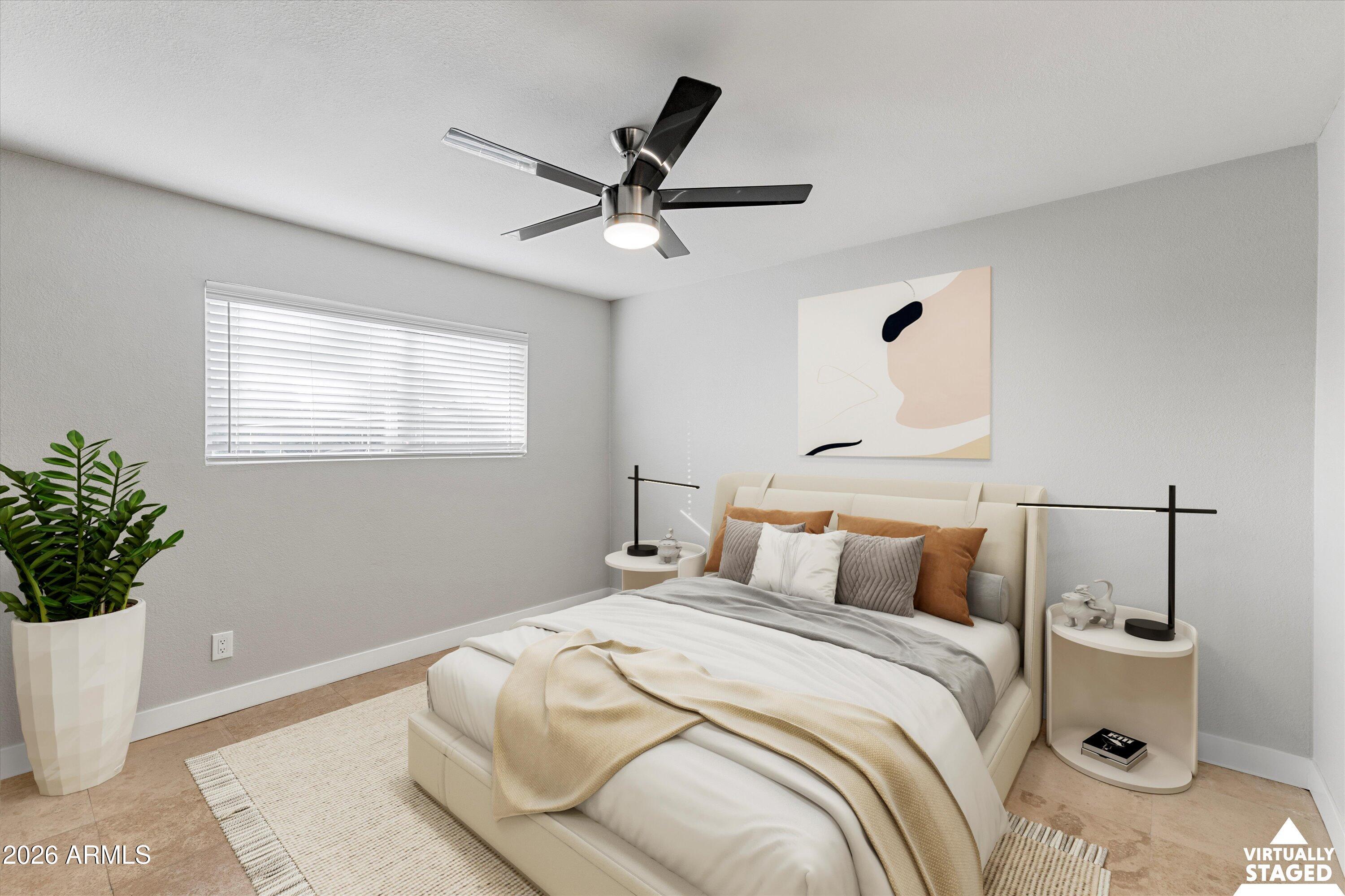 5525 East Thomas Road, Unit L1 Phoenix, AZ 85018 - Photo 25 of 33 a bedroom with a bed and a potted plant