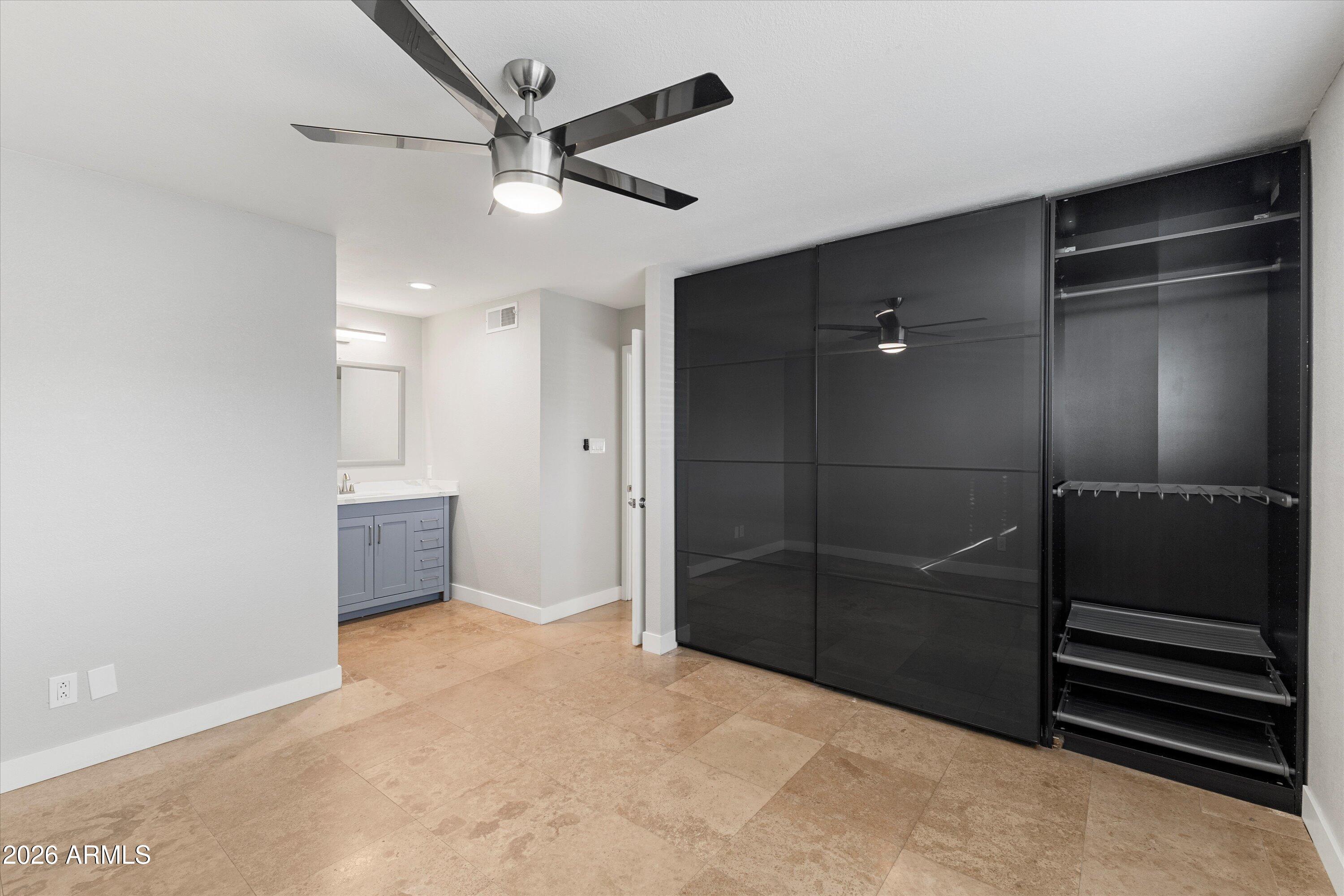 5525 East Thomas Road, Unit L1 Phoenix, AZ 85018 - Photo 27 of 33 a view of an empty room with a ceiling fan