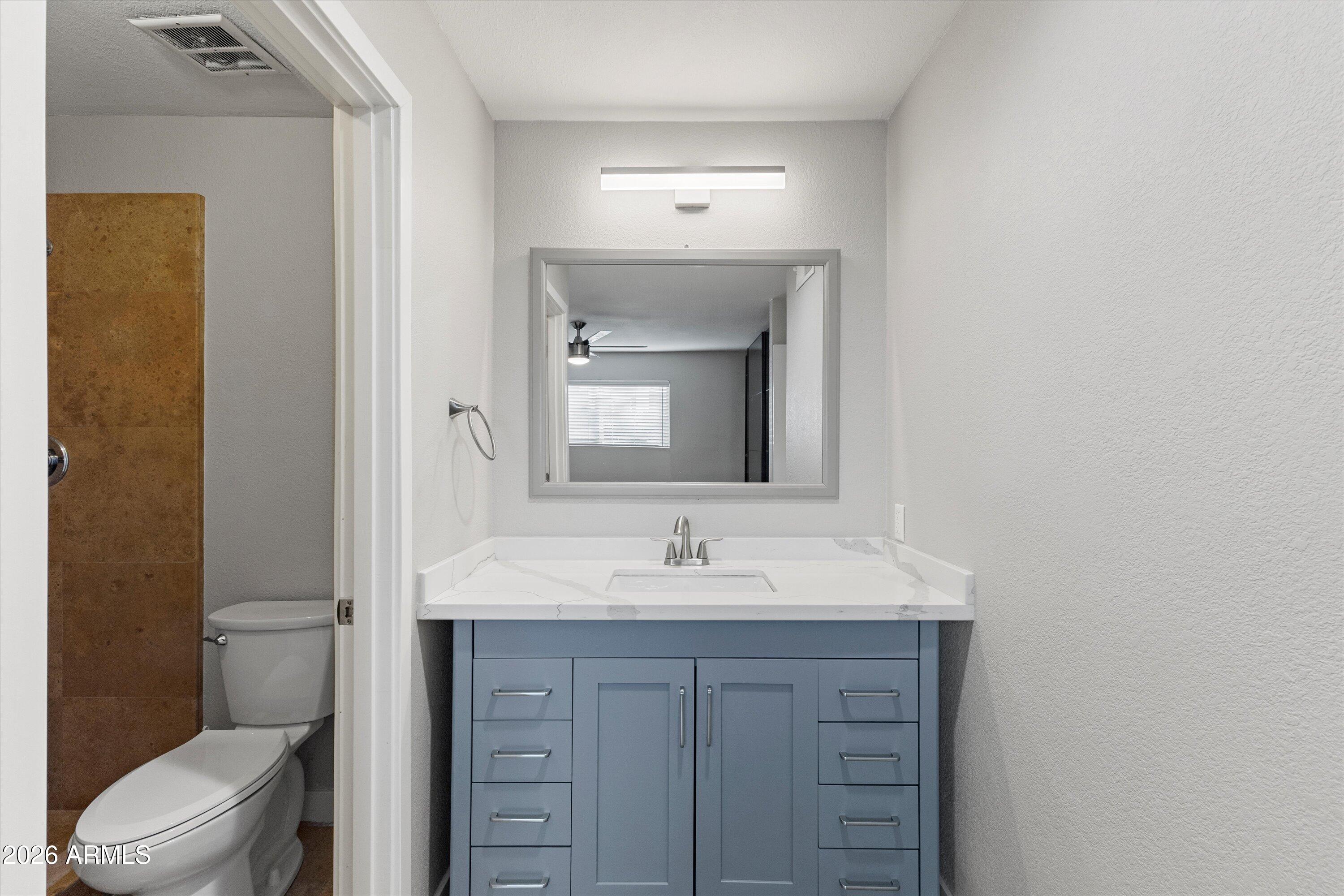 5525 East Thomas Road, Unit L1 Phoenix, AZ 85018 - Photo 29 of 33 a bathroom with a sink and a mirror