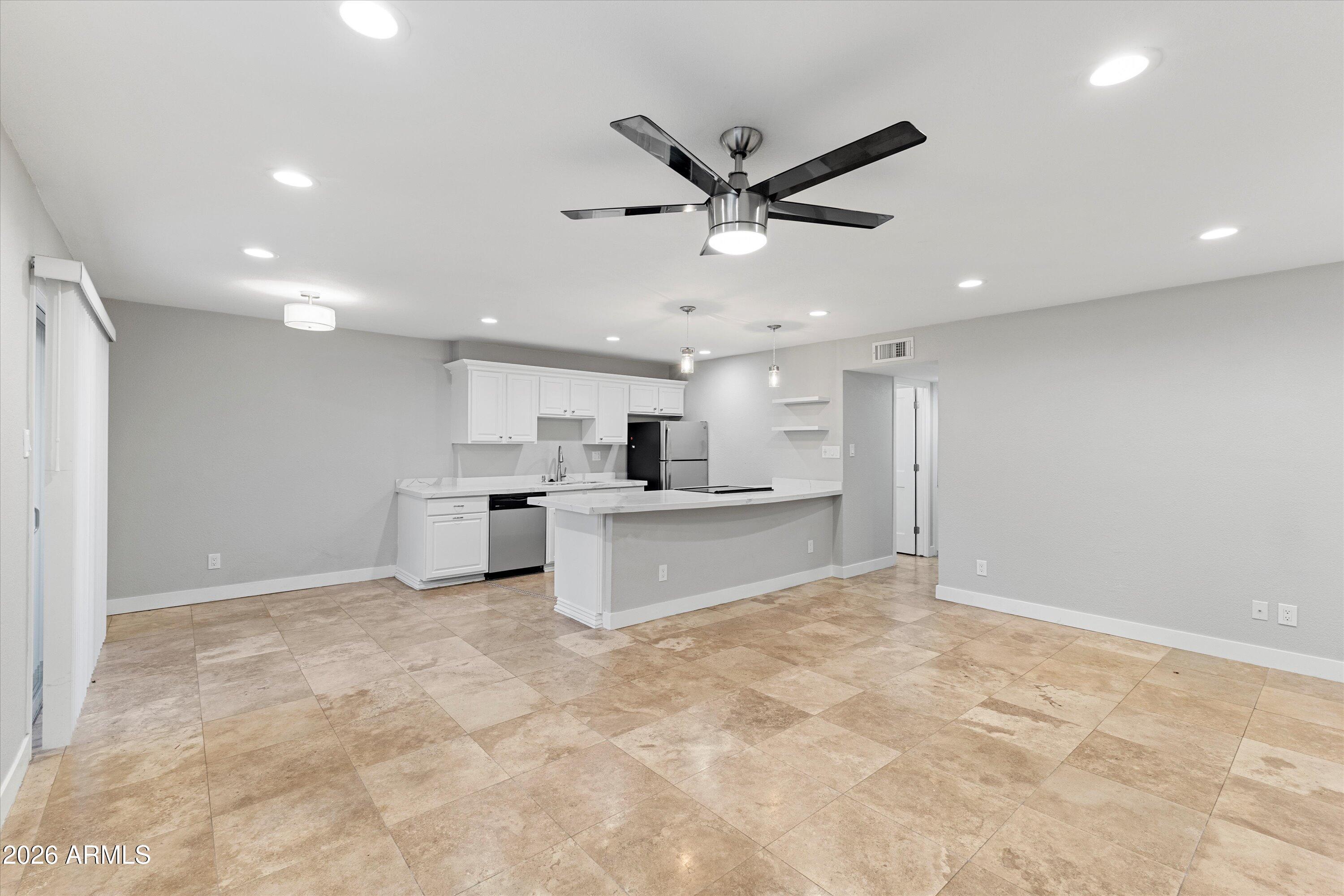 5525 East Thomas Road, Unit L1 Phoenix, AZ 85018 - Photo 6 of 33 a view of a kitchen with a sink and a window