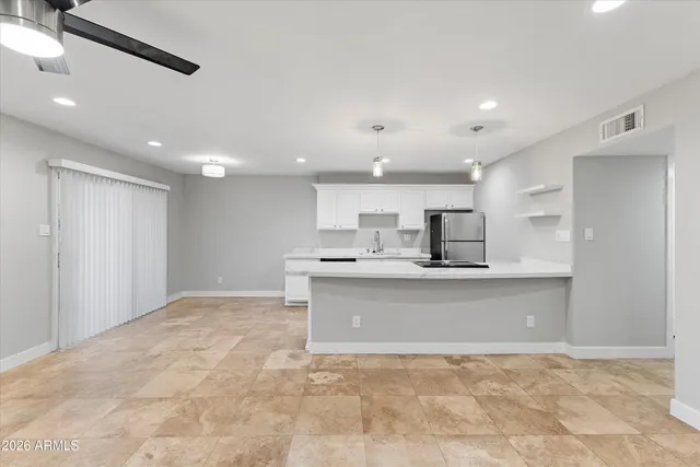 a view of kitchen with sink and microwave