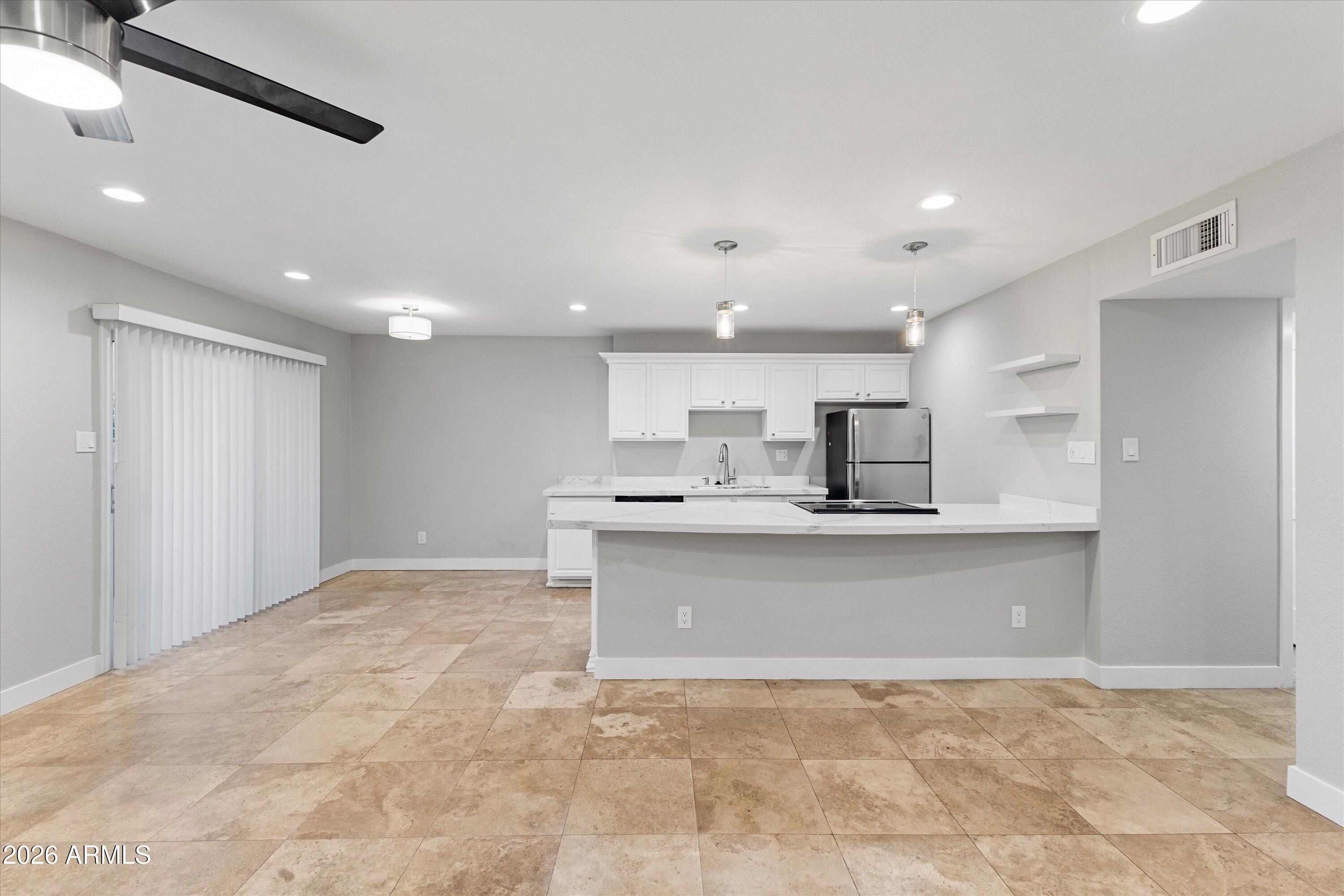 5525 East Thomas Road, Unit L1 Phoenix, AZ 85018 - Photo 8 of 33 a view of kitchen with sink and microwave