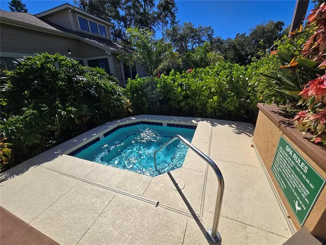 a view of a swimming pool with a patio