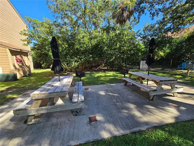 a view of a park with large trees