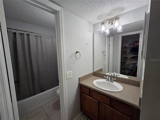 a bathroom with a sink double vanity and a mirror