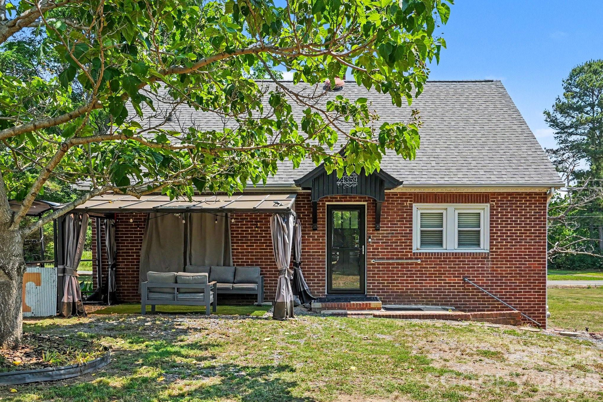 front view of a house with a yard