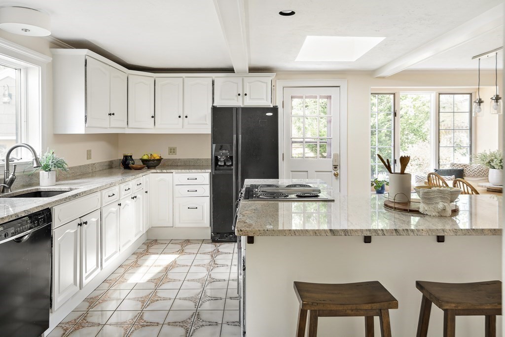 20 Stowell Road Winchester, MA 01890 - Photo 16 of 34 a kitchen with a sink a window and cabinets
