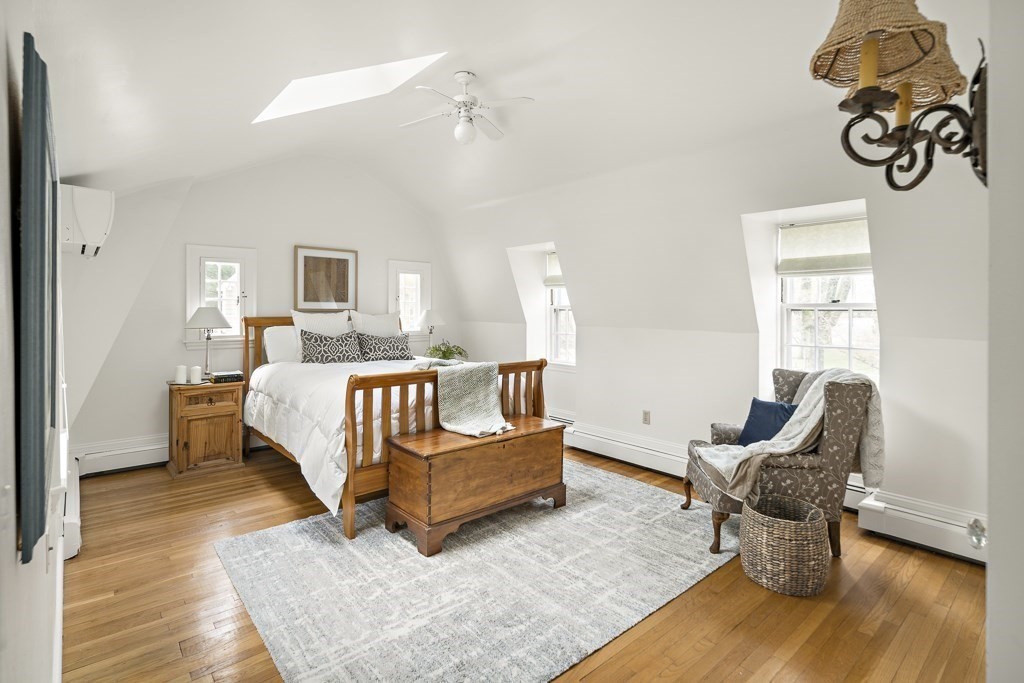 20 Stowell Road Winchester, MA 01890 - Photo 20 of 34 a bedroom with a bed and glass window