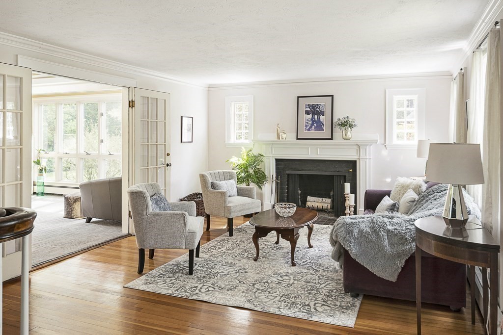20 Stowell Road Winchester, MA 01890 - Photo 2 of 34 a living room with furniture and a fireplace