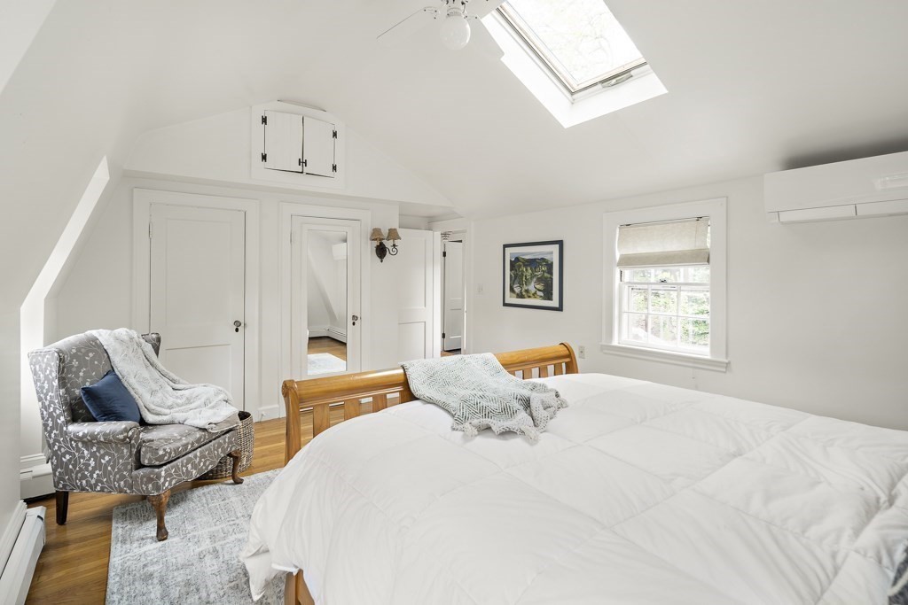 20 Stowell Road Winchester, MA 01890 - Photo 21 of 34 a bedroom with a bed and wooden floor