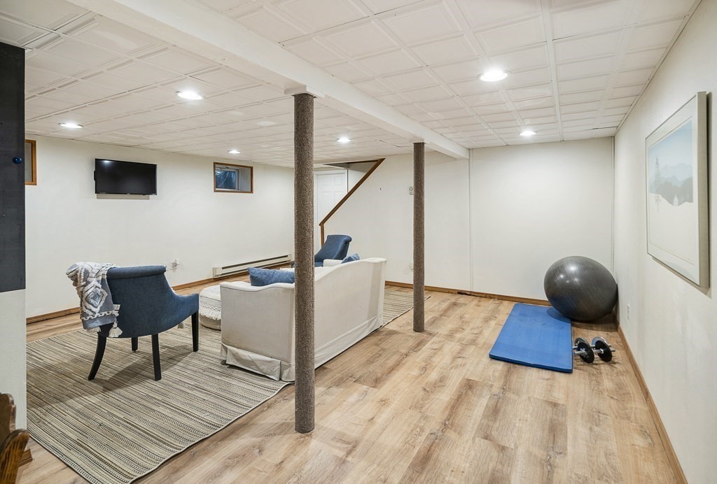 20 Stowell Road Winchester, MA 01890 - Photo 27 of 34 a living room with furniture and a wooden floor