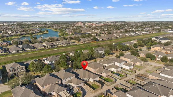 an aerial view of residential houses with outdoor space