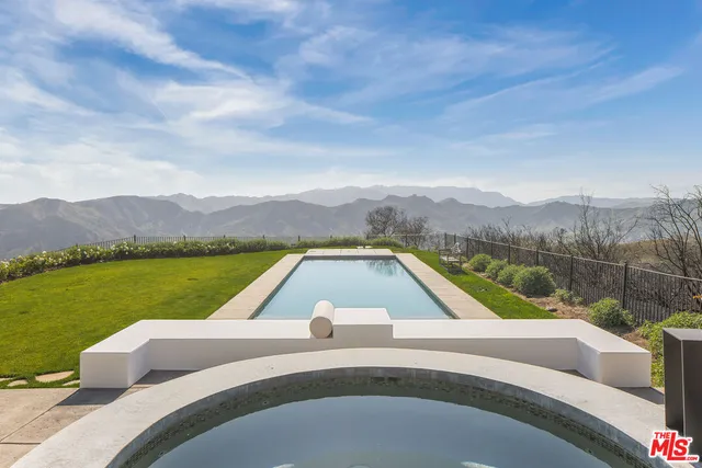 a view of swimming pool with a lake view