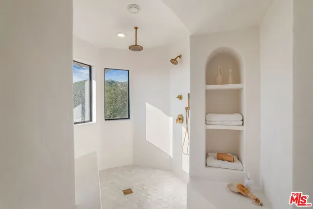 a dining room with a table and chairs