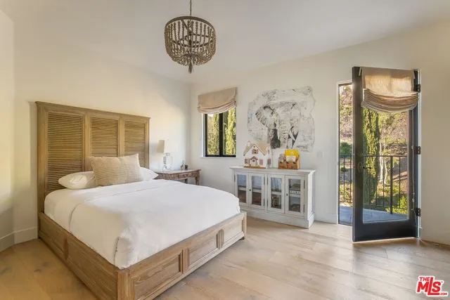 a bathroom with a sink toilet and mirror