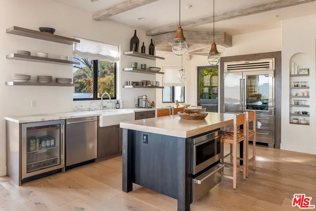 a kitchen with a stove and a refrigerator