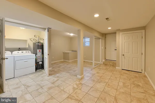 a bedroom with a bed and a night stand