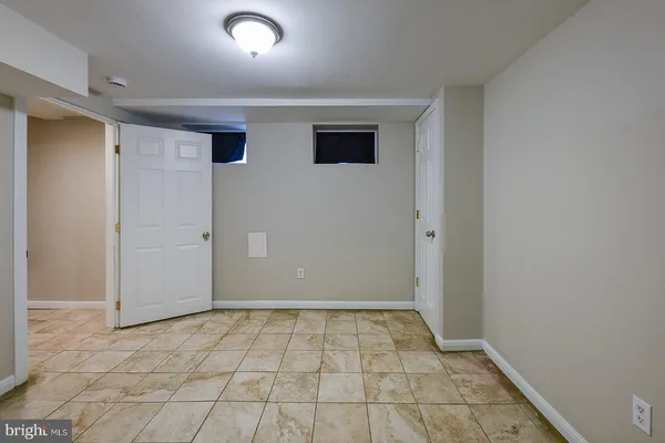 a view of a room with a wooden shelves