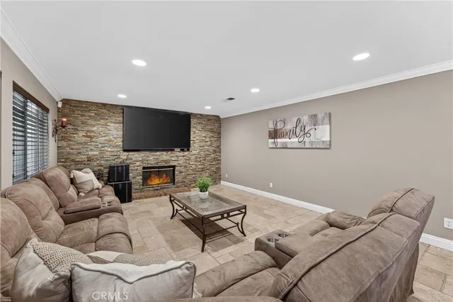 a kitchen with a stove a refrigerator a sink and chairs