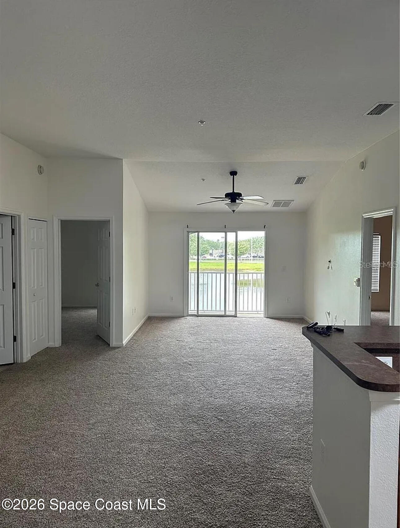 4117 Meander Place, Unit 206 Rockledge, FL 32955 - Photo 4 of 15 a view of an empty room with a window