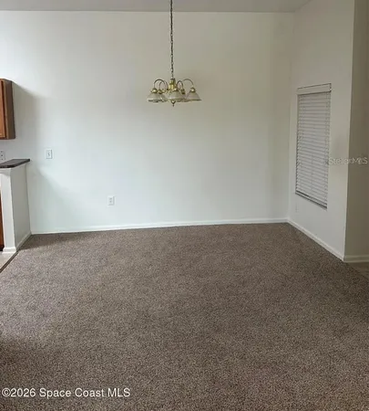 a view of a room with an empty space