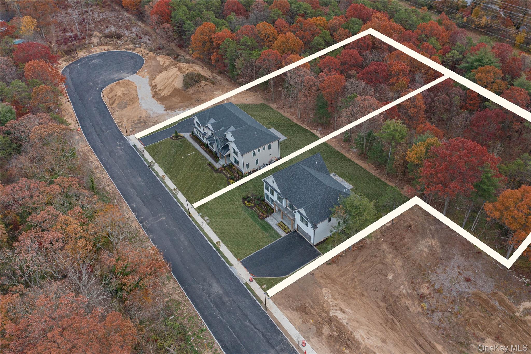 Lot 2-1003 Baldwin Path Dix Hills, NY 11746 - Photo 3 of 20 View of subject property with a tree filled landscape