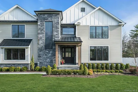 a view of front a house with a yard