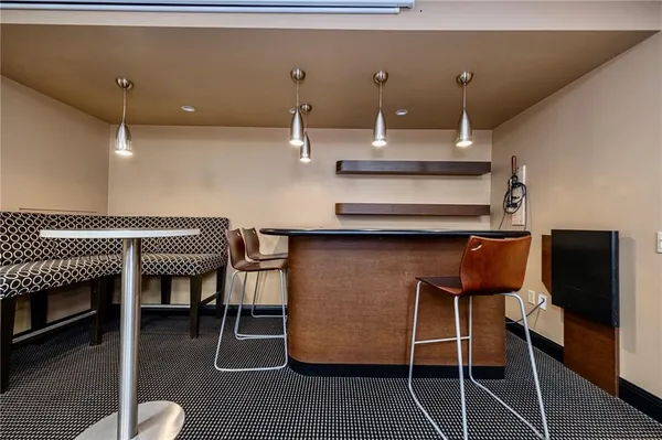 a kitchen with a dining table and chairs