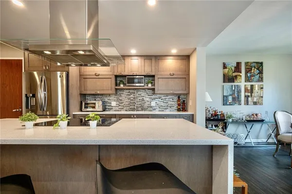 a kitchen with counter top space cabinets and stainless steel appliances